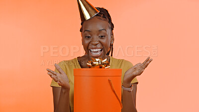 Buy stock photo Birthday, surprise and black woman with present, box or gift in studio background or celebration. Wow, congratulations and excited winner of giveaway, package or product on offer for party and event