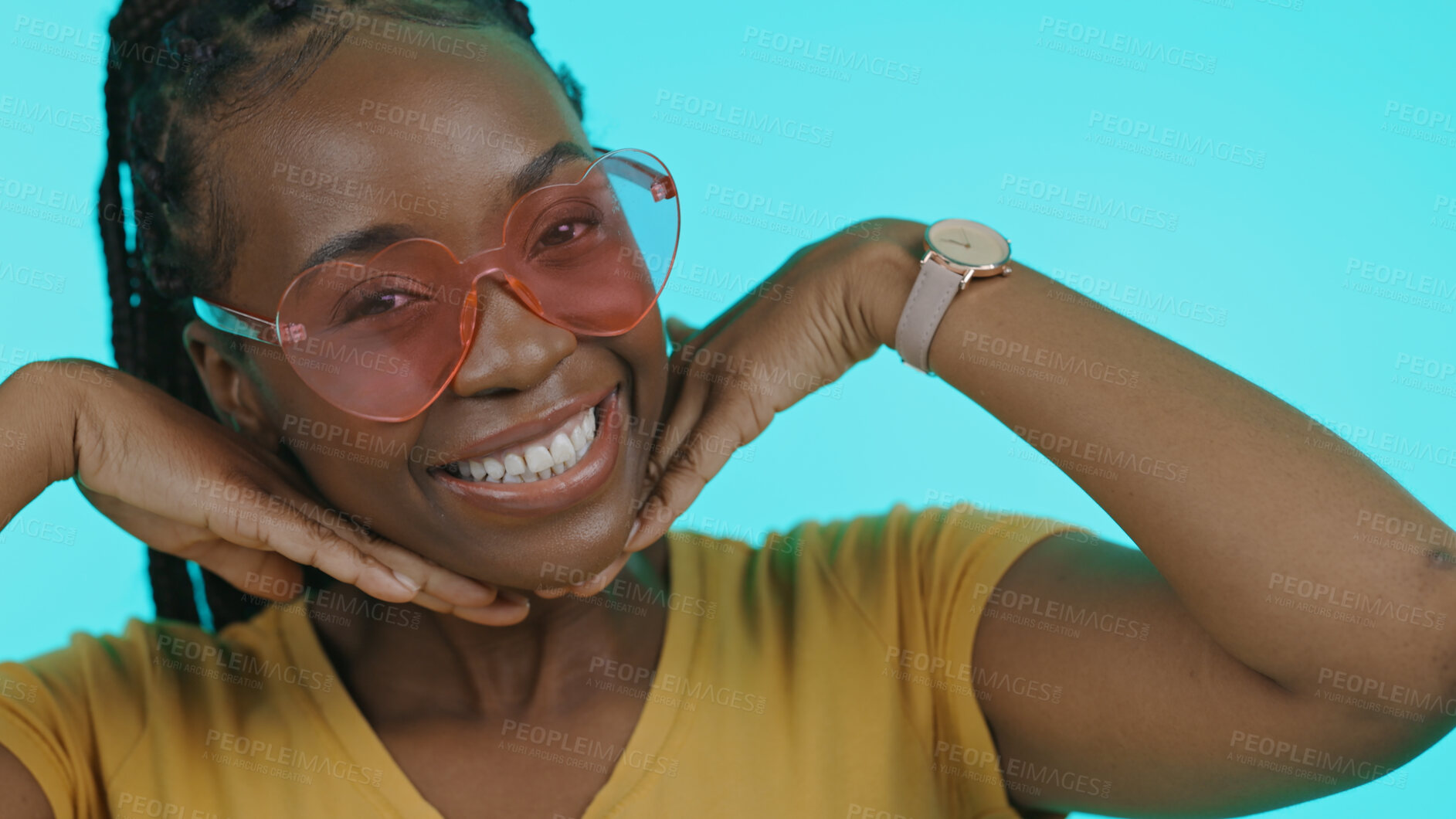 Buy stock photo Happy, heart and portrait of a black woman with sunglasses for summer on a blue background. Smile, perfect and a model or African girl with trendy eyewear, fashion and hands on face on a backdrop