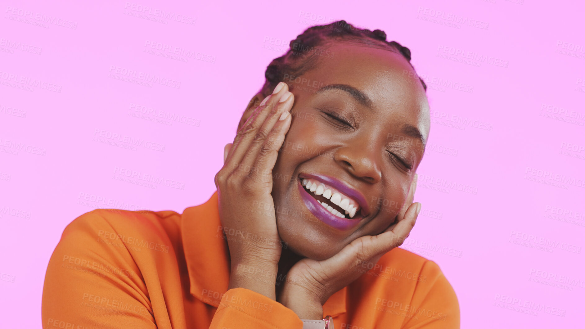 Buy stock photo Woman, hands and happy on face with makeup, smile and excited with playful expression by pink background. Black person, emoji or self love for cosmetic, lipstick or beauty aesthetic and studio mockup