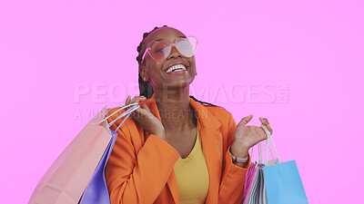 Buy stock photo Woman, shopping bag and sunglasses for fashion sale, discount and giveaway prize or competition in studio. Portrait of african person or excited customer with gift or funky style on pink background