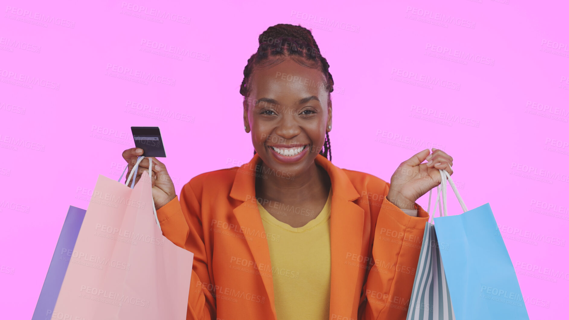 Buy stock photo Woman, portrait and credit card with shopping bag for financial success, sale and discount on pink background. Excited customer or african winner in celebration for banking, fashion or gift in studio