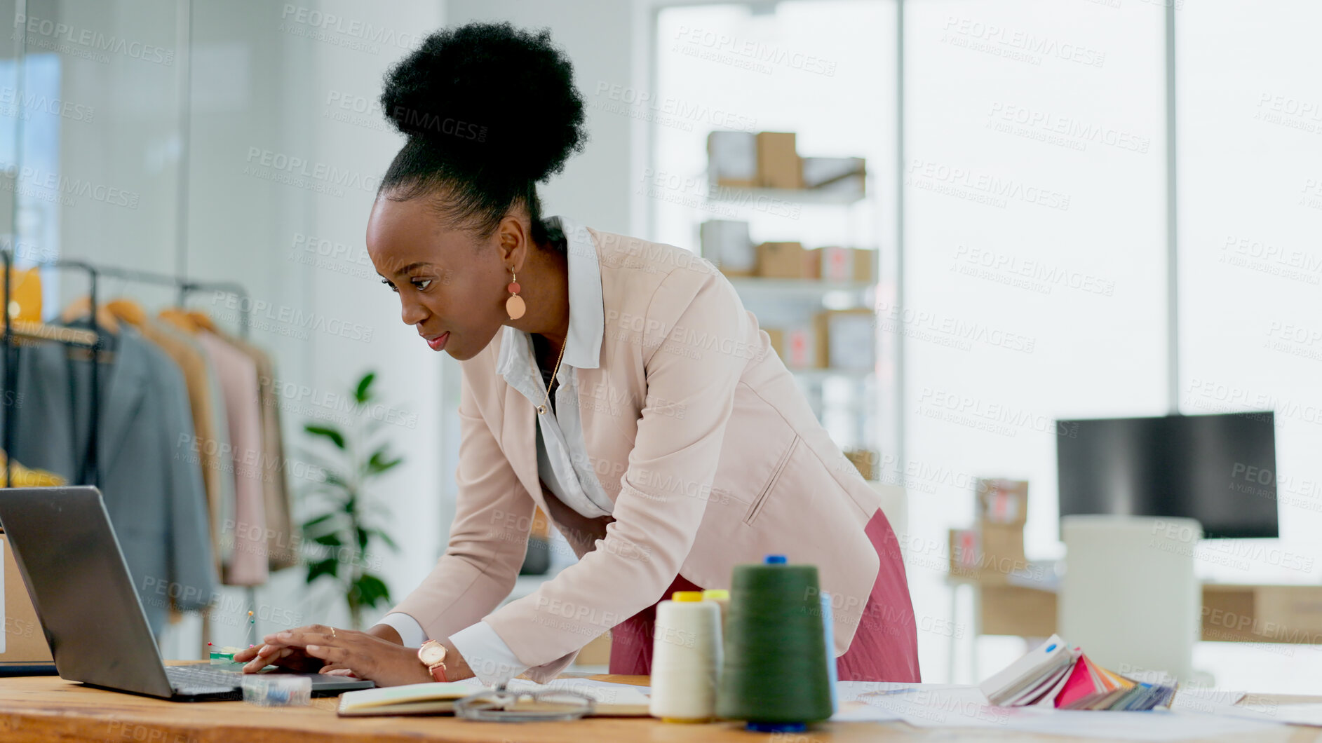 Buy stock photo Black woman, laptop and fashion designer in small business, office or ideas at boutique store. African female person working on computer in logistics for clothing, planning or schedule delivery