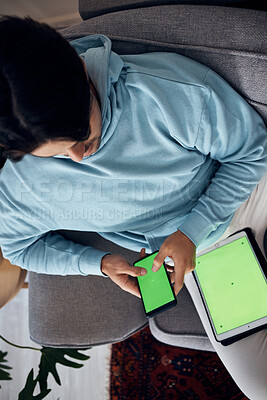 Buy stock photo Phone, green screen and a man playing games on a sofa in the living room of his home from above. Tablet, gaming and young gamer using a display or screen with tracking markers for entertainment