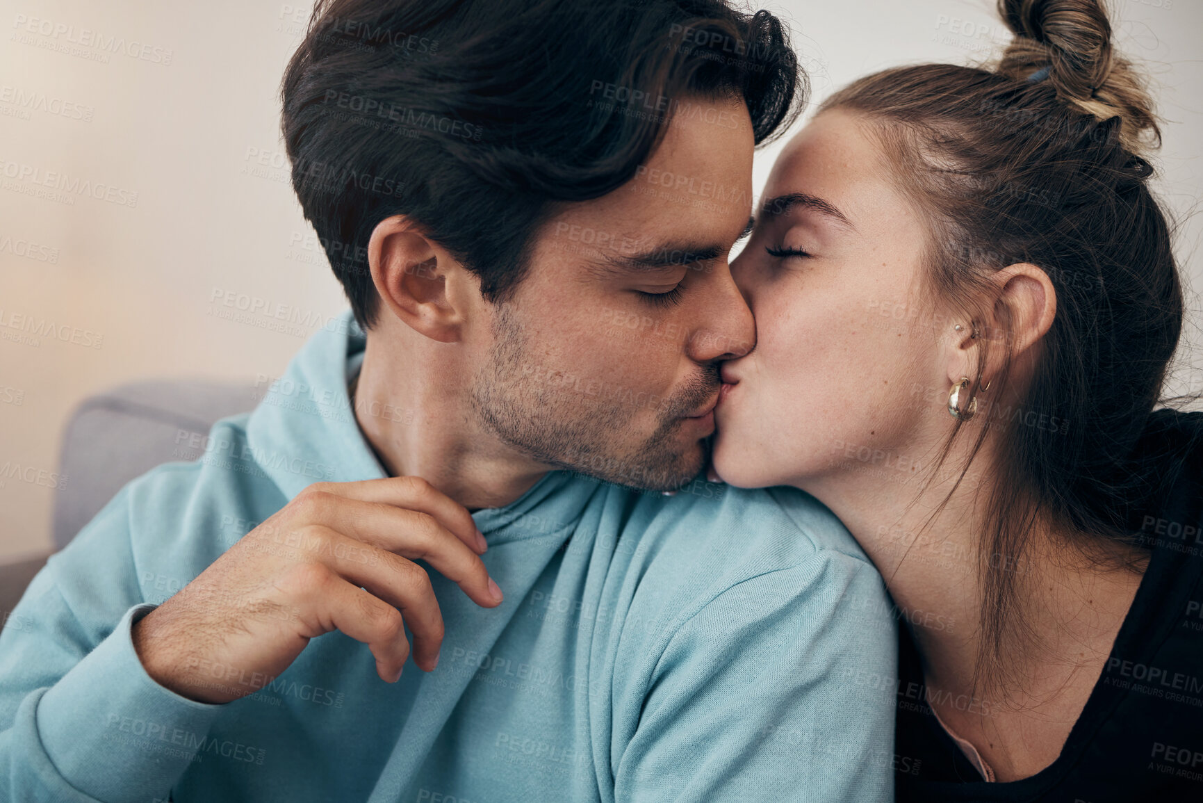 Buy stock photo Couple, relax and kiss on sofa with love in home, living room or house with happy, partnership or marriage. Romantic, people and bonding with man and woman in affection for support and care together