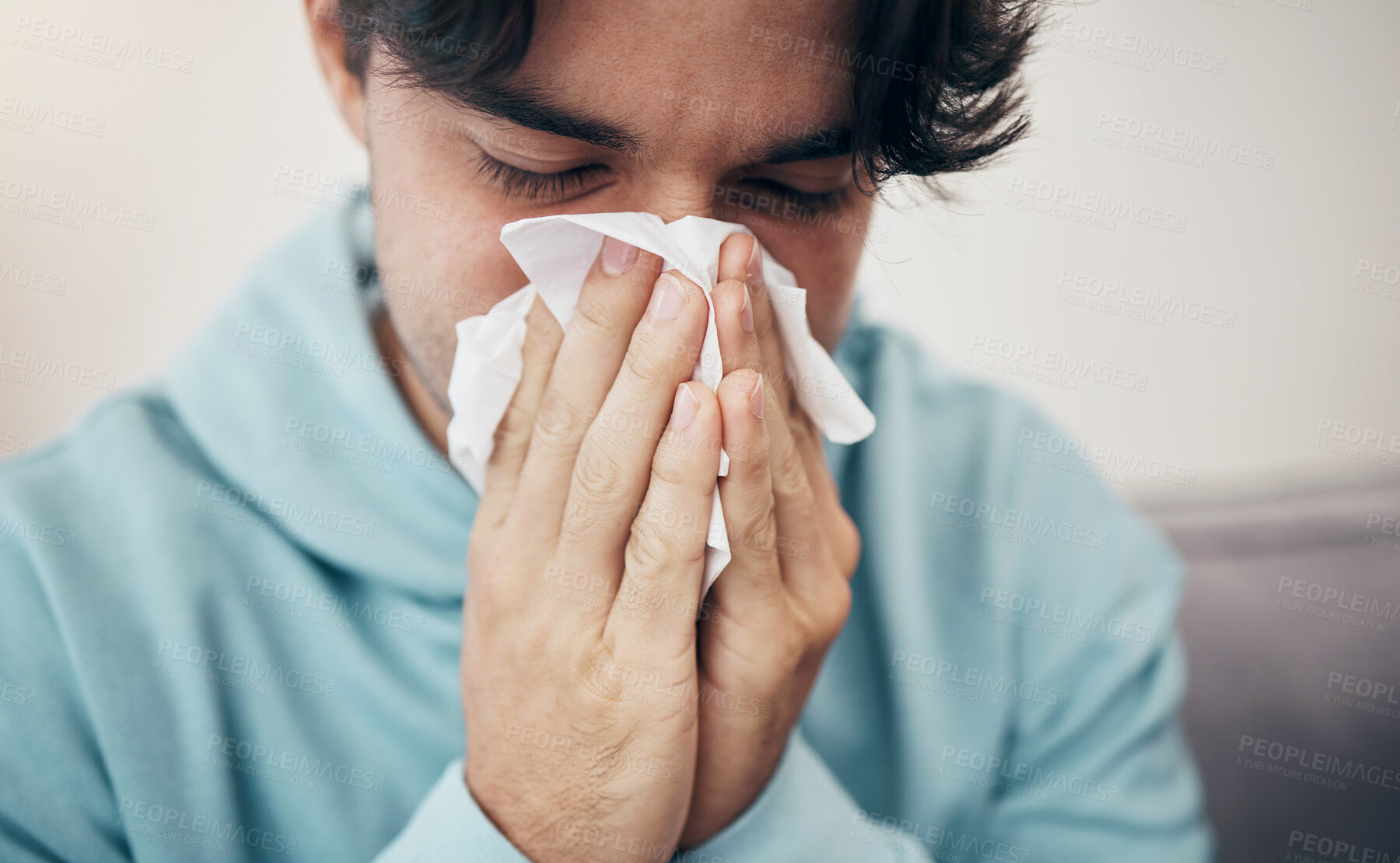 Buy stock photo Man, sick and couch with tissue, sickness and virus for infection, sinus and cold symptoms. Sneeze, blowing nose and allergy in living room sofa, hayfever and healthcare for disease, fever or alone