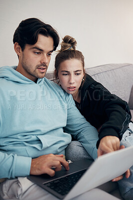 Buy stock photo Laptop, stress and couple pointing in home living room for budget planning, taxes or debt. Computer, man and frustrated woman on sofa for finance, asset management and mortgage, loan and rent bills