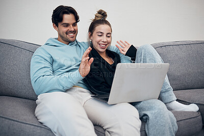 Buy stock photo Couple, video call and wave on laptop in living room with communication for family. Young man, woman and together in happiness, embrace or love in relationship on sofa with technology, web or app