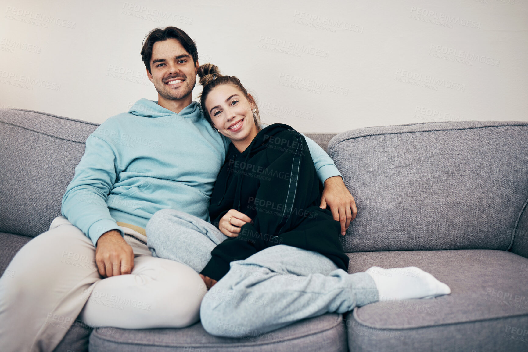 Buy stock photo Portrait, relax and smile with a couple on a sofa in the living room of their home together for bonding. Love, hug or date with a happy man and woman in their apartment for romance or relationship