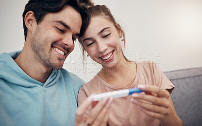 Buy stock photo Pregnancy, test and happy couple in home living room, reading good news and check positive results. Stick, man and pregnant woman smile on sofa excited for family, future maternity and ivf fertility