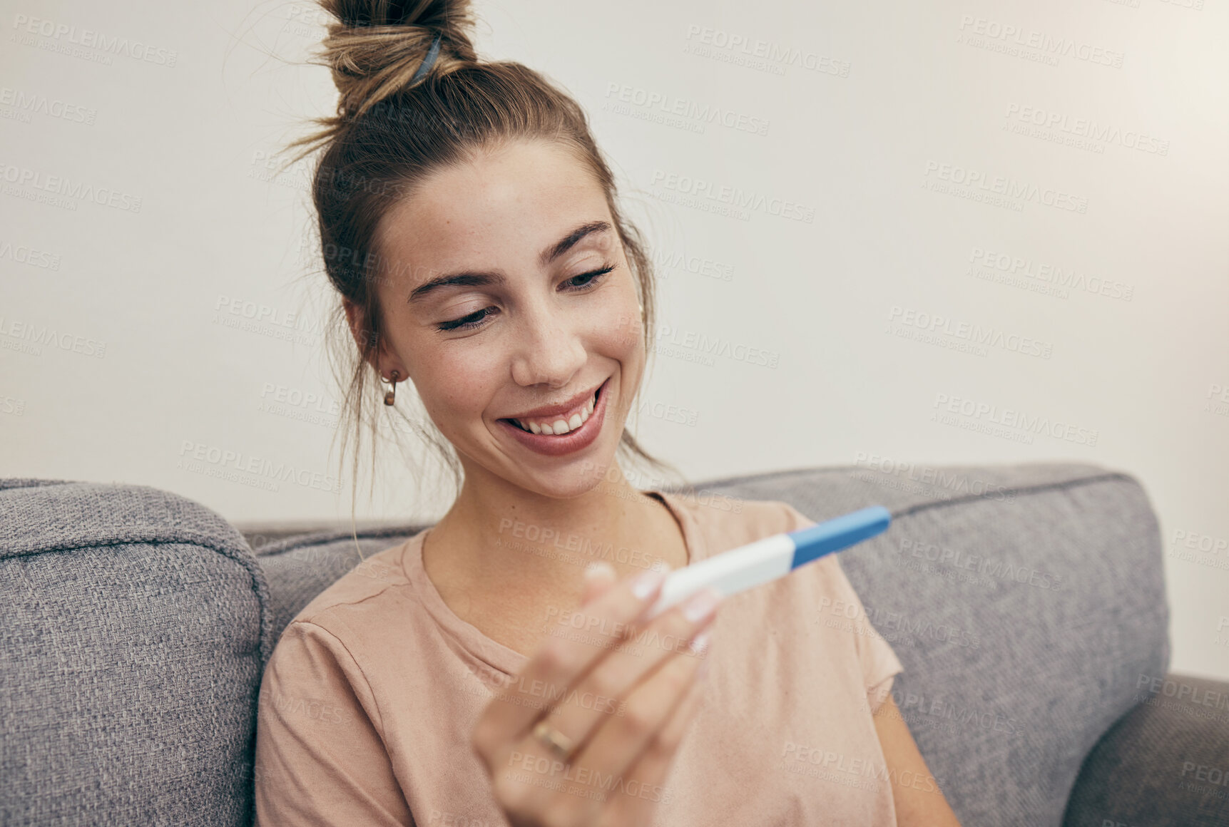 Buy stock photo Pregnancy test, smile and woman on sofa in home, reading good news and check positive results. Pregnant, stick and happy mother in living room excited for success, future maternity and ivf fertility