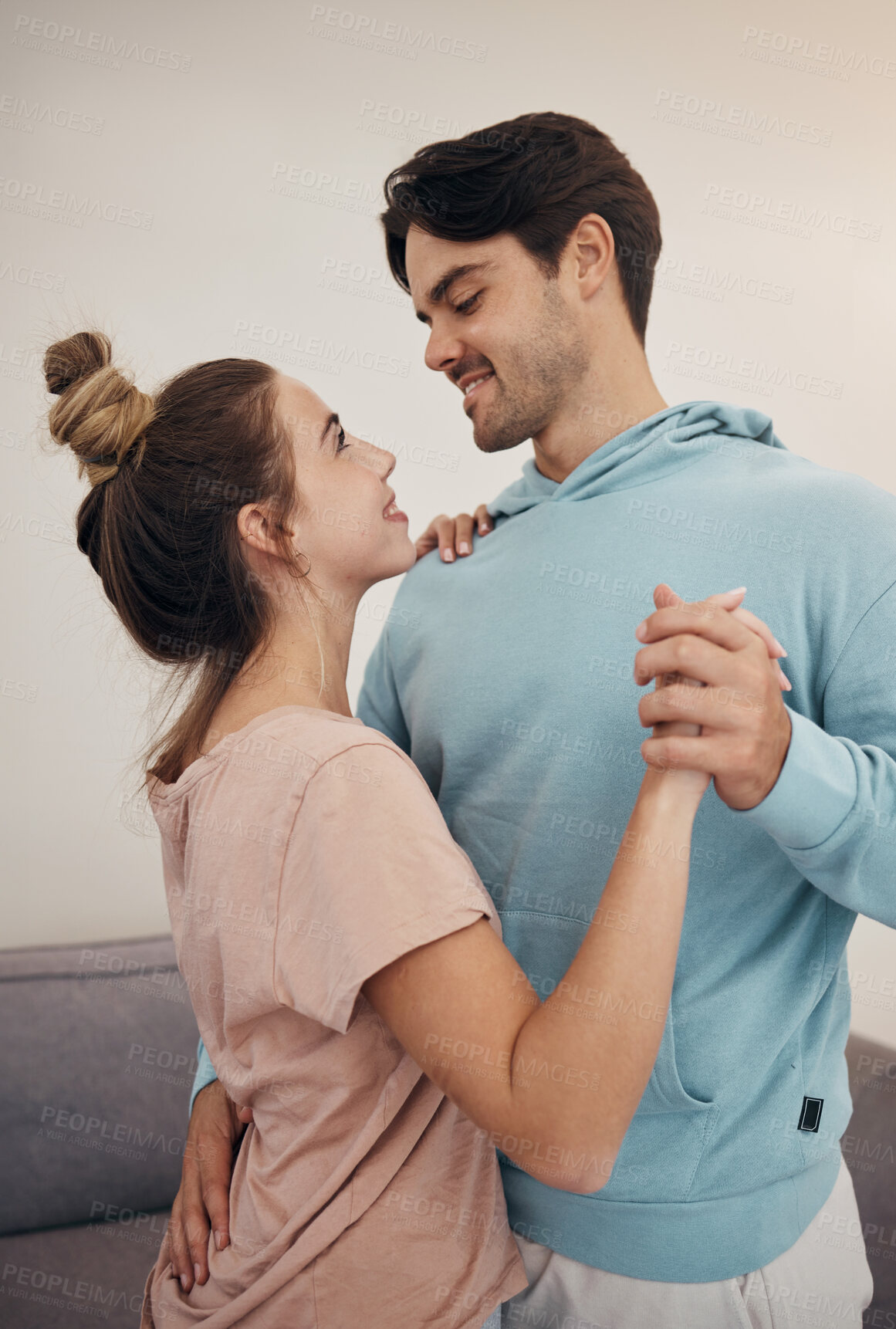 Buy stock photo Couple, together and embrace by dance in living room for romance, love or bond. Young man, woman and smile with happiness in home for marriage, relationship or care on honeymoon, vacation or holiday