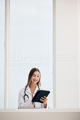 Buy stock photo Female doctor, smile and reading on tablet in office for patient results, diagnosis or report. Face, woman and happy while looking at screen for treatment, healthcare or medicine with web or mockup