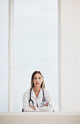 Buy stock photo Portrait, doctor and medical with a woman arms crossed in a hospital for healthcare, consulting or trust. Space, serious and a confident young medicine professional at a desk in a cardiology clinic