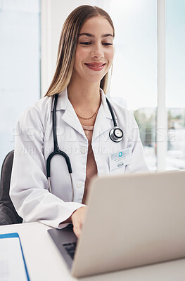 Buy stock photo Laptop, research and woman doctor working in office at hospital for reading on diagnosis or treatment. Smile, surgeon and young female healthcare worker working on computer in a medicare clinic.