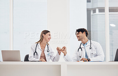 Buy stock photo Man, woman and doctors with fist bump, teamwork and agreement with healthcare, cooperation and smile. Happy people, medical professionals and coworkers with handshake, collaboration and celebration