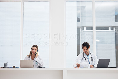 Buy stock photo Doctors, team and hospital phone call, planning or communication for telehealth services or clinic research. Medical people working in office or reception desk with laptop, documents and mobile chat