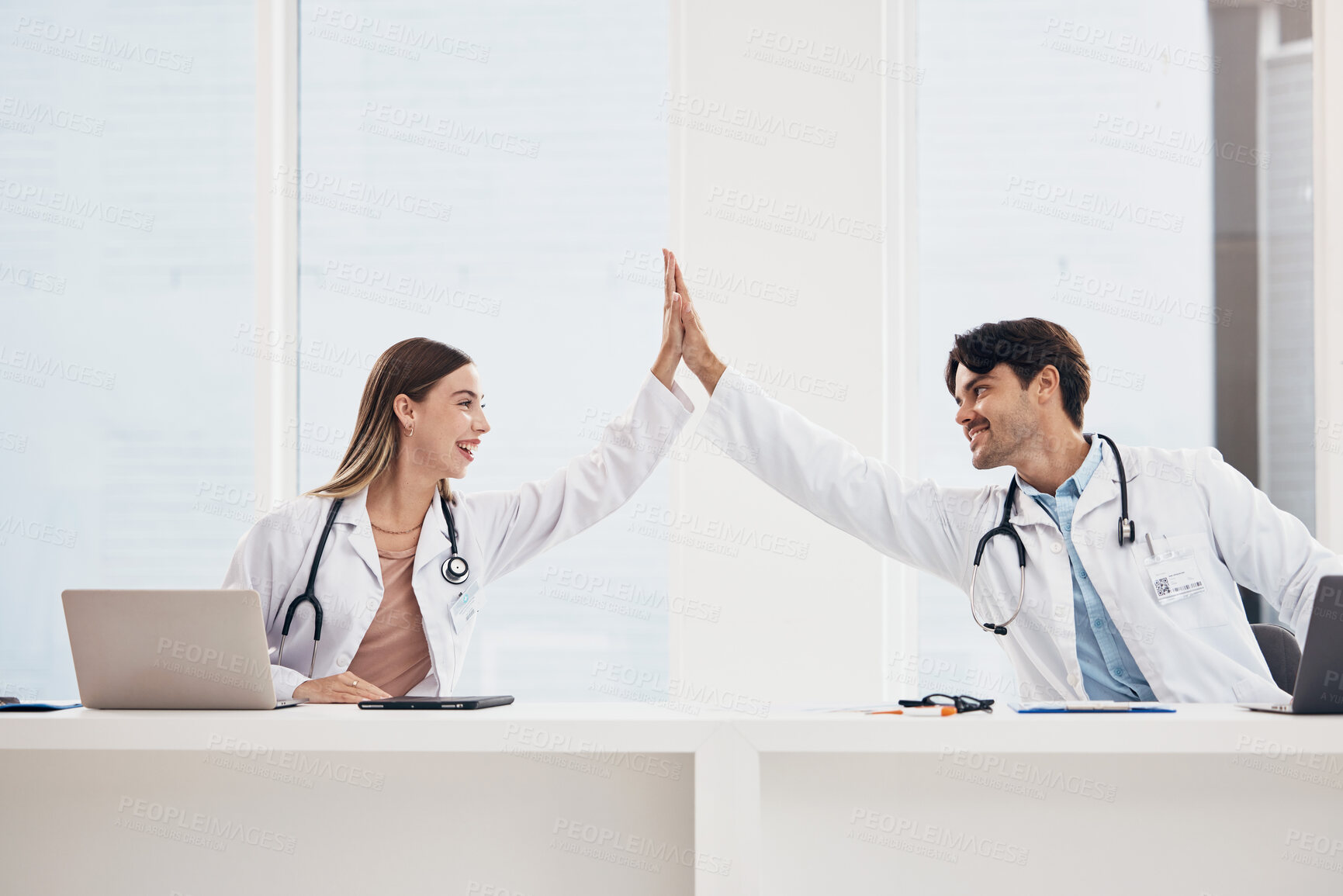 Buy stock photo Success, high five or doctors in meeting for a strategy, goals or working in hospital for healthcare together. Man, happy woman or excited surgeons with nursing target, medical mission or teamwork