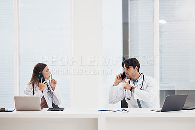 Buy stock photo Doctors, talking and people with phone call in office with confidential, info and gesture to whisper. Medical, nurse and busy with administration and frustrated employees with noise or telehealth