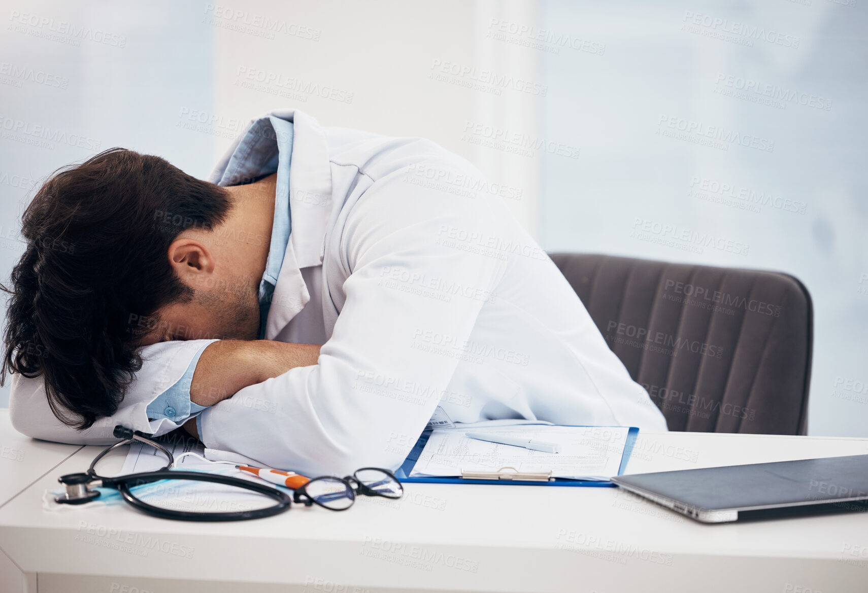 Buy stock photo Man, doctor and sleeping for break, relax or burnout on desk in mental health or mistake at hospital office. Tired male person or medical surgeon chilling in rest or asleep on work desk at clinic