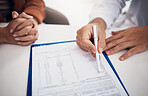 Doctor, hands and writing on documents with patient for life insurance, policy or legal agreement at hospital. Closeup of medical employee showing paperwork, agreement or checklist on desk at clinic