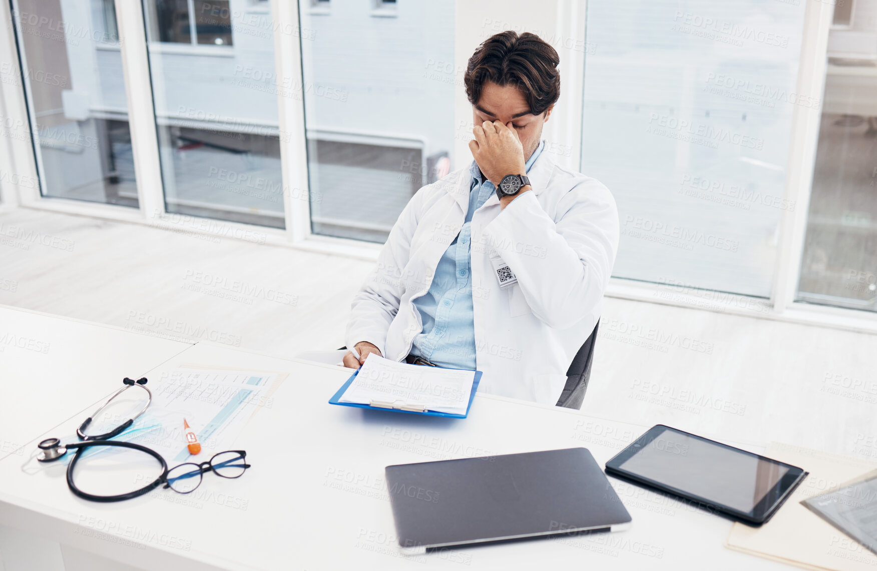 Buy stock photo Healthcare, doctor and man with a headache, stress and overworked with burnout, surgeon and tired. Person, employee and medical professional with a migraine, fatigue and exhausted in a hospital