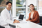 Doctor, man and woman with laptop in portrait, smile and documents for healthcare consulting in hospital office. Medic, patient and happy for results, report and computer with help, wellness or exam