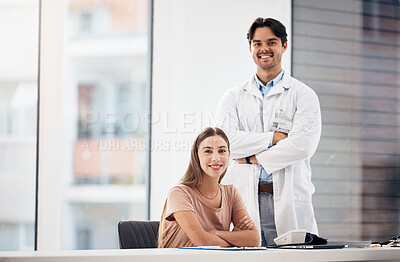 Buy stock photo Doctors, man and woman with arms crossed in portrait, smile and hospital office with leadership for medical job. Clinic staff, medic team and happy together for wellness with receptionist at desk
