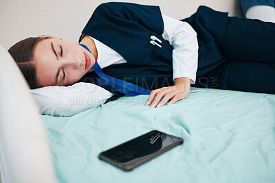 Buy stock photo Sleeping, hospital and tired nurse with phone for rest, nap and break for burnout, exhausted and fatigue. Healthcare, insomnia and worker relax for medical service, wellness and stress in clinic