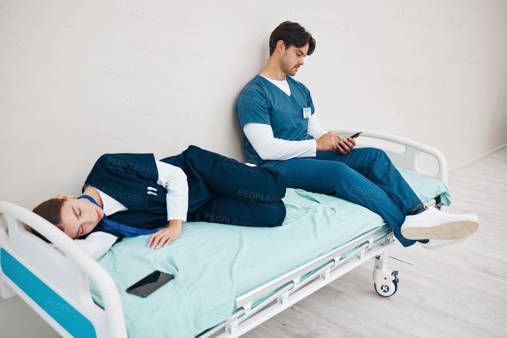 Buy stock photo Sleeping, hospital and nurses with phone for break, nap and rest for burnout, exhausted and fatigue. Healthcare, team and health workers relax for medical service, wellness and stress in clinic