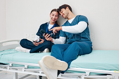 Buy stock photo Doctor, student friends and break on phone on a hospital, healthcare and clinic bed with social media. Media, mobile and happy young people together with rest from medical and nursing internship