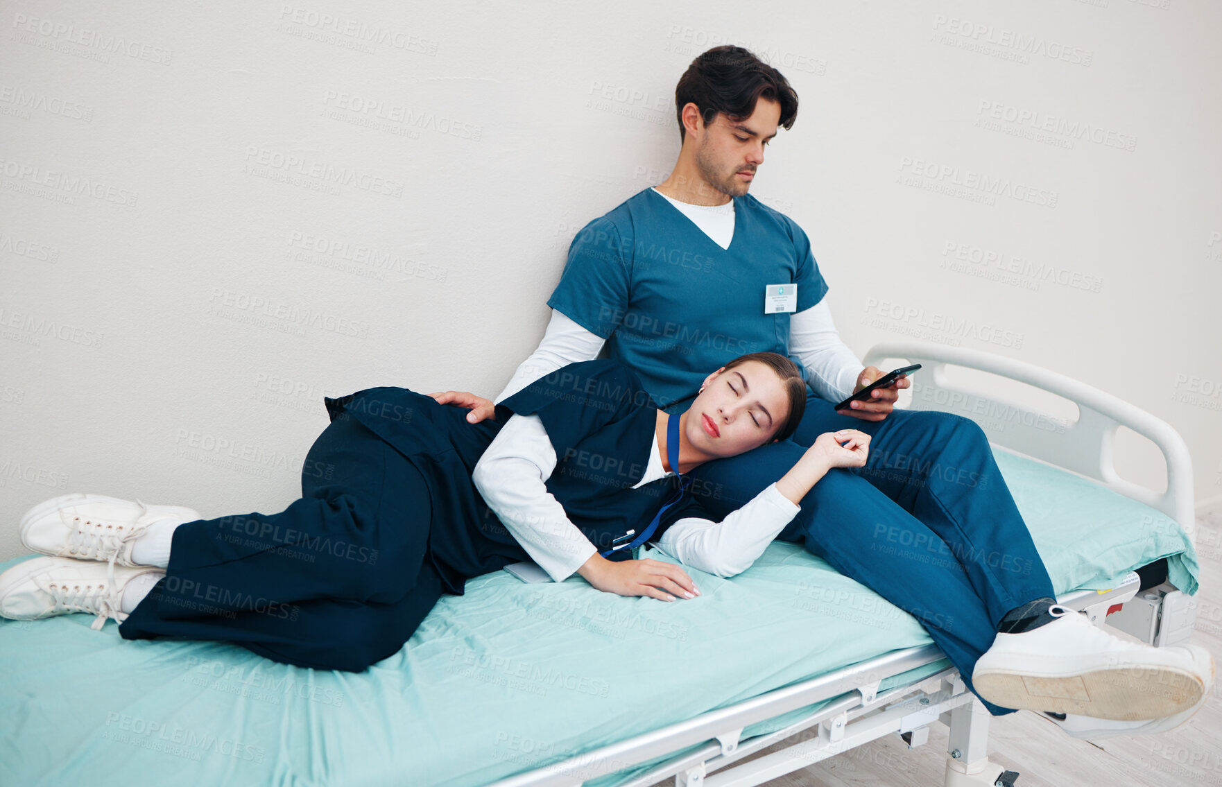 Buy stock photo Tired, nurses and sleep on break in hospital or relax on bed in clinic with friends, fatigue and support. Reading, phone and care for mental health in healthcare with doctors or medical staff