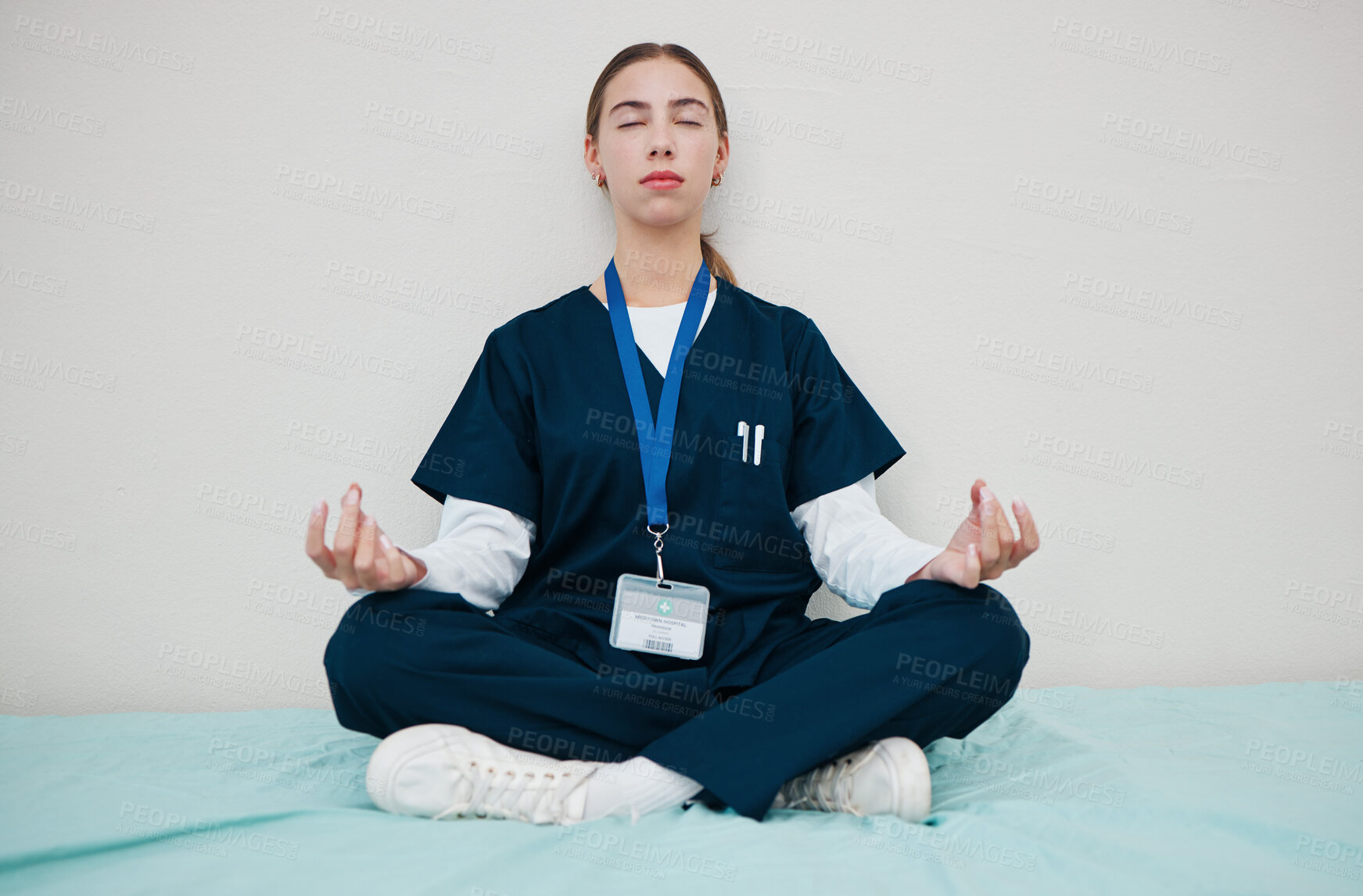 Buy stock photo Woman, nurse and meditate to relax in hospital, healing and break from work, yoga and calm for mental health. Medical professional, peace and wellness for aura, zen and chakra for balance in career