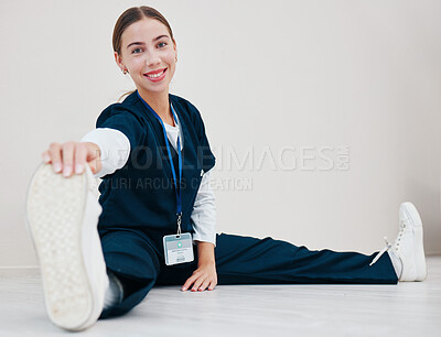 Buy stock photo Stretching, feet and nurse with legs on floor in exercise at the start of shift in clinic internship or healthcare. Work, preparation and portrait of warm up body for wellness and fitness in hospital