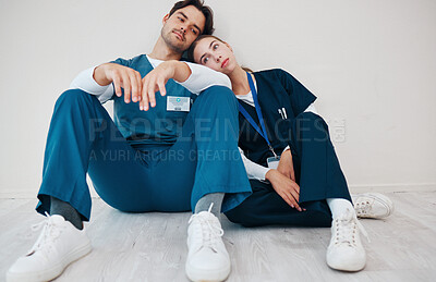 Buy stock photo Sad doctors, hospital floor and woman with man, support and lost with regret, death and fail in surgery. Medic, partnership and burnout with depression, mistake or anxiety for healthcare in clinic