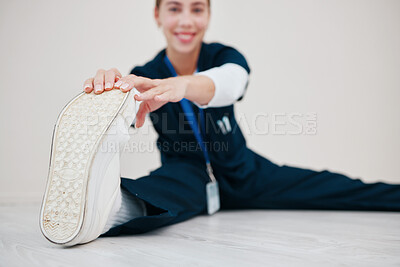 Buy stock photo Feet, stretching and nurse with legs on floor in exercise at the start of shift in healthcare, clinic or internship. Work, preparation or portrait of warm up body for wellness and fitness in hospital