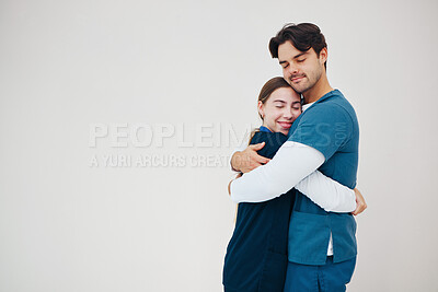 Buy stock photo Doctor, colleagues and hug smile at healthcare clinic, support or work stress. Medical professionals, friends or helping comfort in scrubs or wall background, mockup space or happy trust at hospital