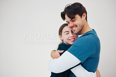 Buy stock photo Doctor, colleagues and hug happy at healthcare clinic, support or work. Medical professional, couple of friends or helping comfort or team in scrubs on white background, mockup or trust at hospital