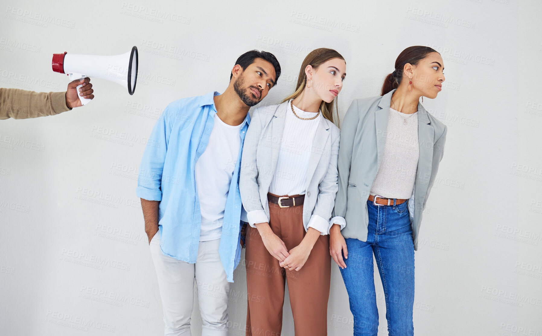 Buy stock photo Megaphone, message and business people in studio to listen to a broadcast announcement on a white background. Loud, sound or noise for the communication of a news alert or information with a bullhorn