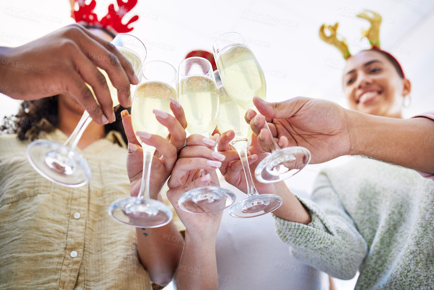 Buy stock photo Hands, group and champagne toast at Christmas, office party and celebration drink with cheers with friends. Excited people, xmas and glass for alcohol, sparkling wine and happy at event for holiday