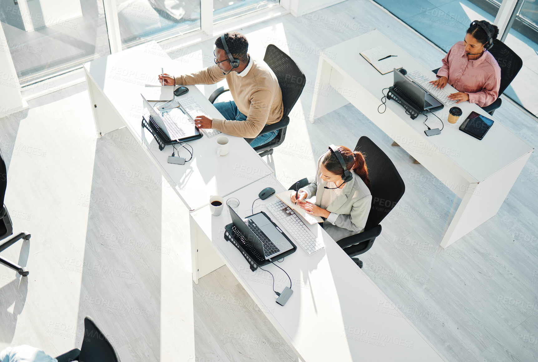 Buy stock photo Call center, group and team at telemarketing help desk with laptop for customer service, IT support or coworking agency from above. Sales people, online consulting and questions for telecom advisory 