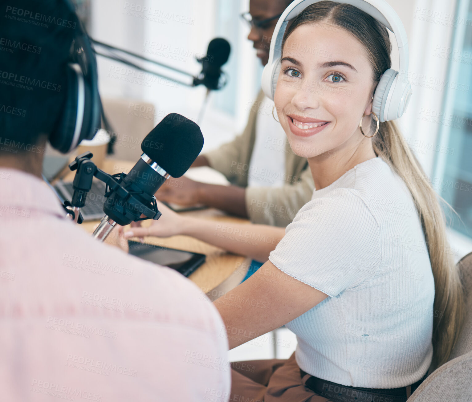 Buy stock photo Recording, podcast and portrait of woman in office in conversation with people, headphones and microphone. Radio, broadcast and person hosting a group discussion, show and influencer business