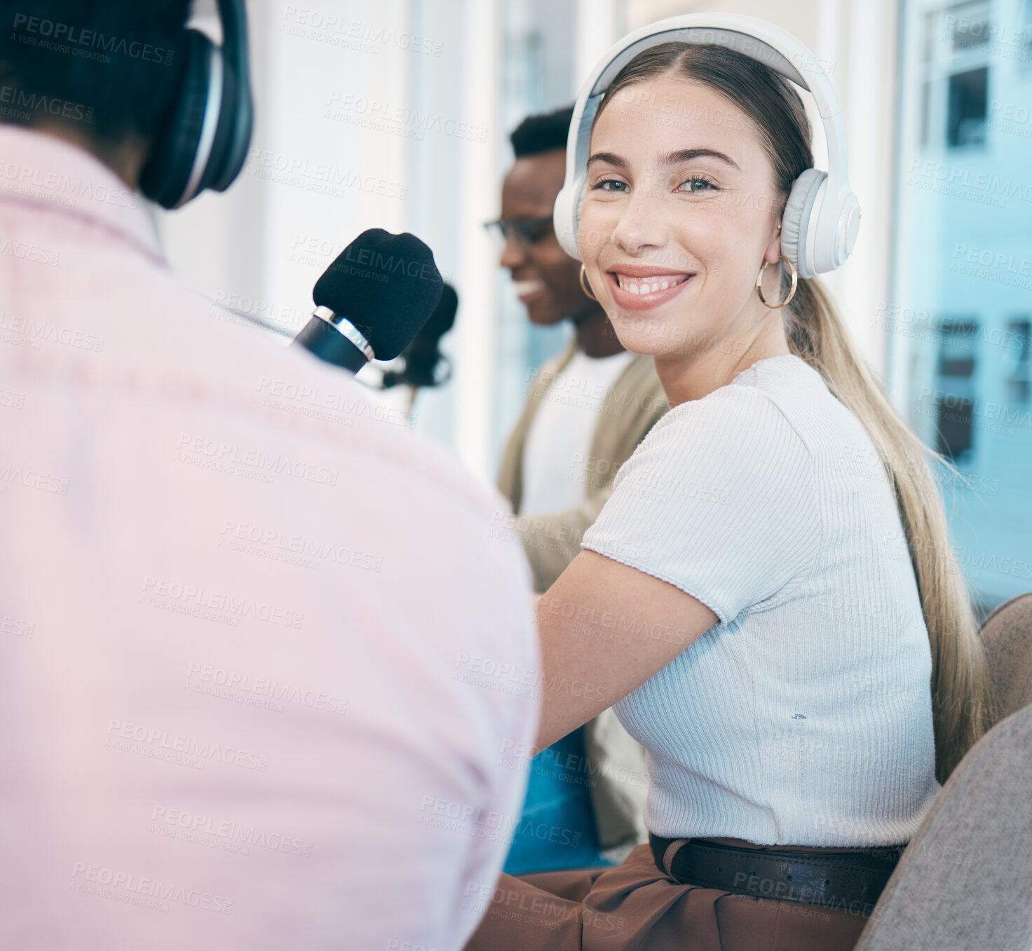 Buy stock photo Radio, podcast and portrait of woman in office in conversation with people, headphones and microphone. Recording, broadcast and speaker hosting a group interview, show and influencer business