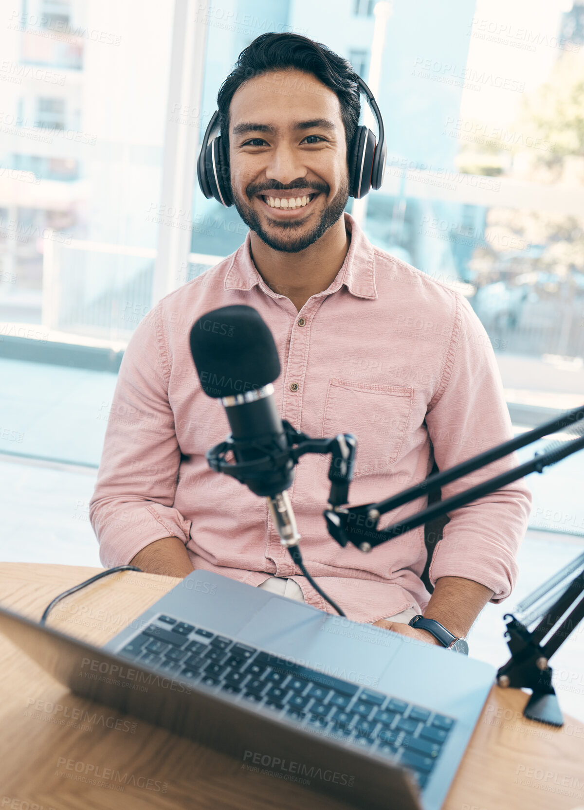 Buy stock photo Radio, podcast and portrait of happy asian man in studio live streaming talk show, blog or news announcement with laptop. Recording, face or Japanese guy dj hosting broadcast, speech or entertainment