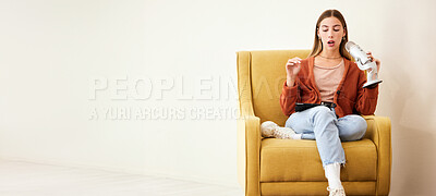 Buy stock photo Microphone, production and woman presenter with podcast on a chair by a wall with mockup space. Radio, broadcast and young female person hosting a journalism talk show in a modern recording space.