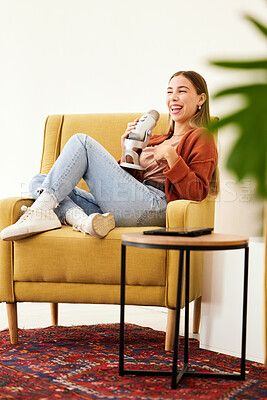 Buy stock photo Microphone, smile and woman hosting a podcast on a chair by a wall in her modern home. Radio, broadcast and happy young female person hosting a journalism talk show in a recording space at her house.