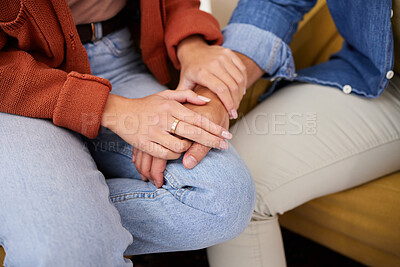 Buy stock photo Couple, holding hands and closeup on couch, home and care with love, bonding and kindness in relationship. People, together and support with empathy, trust and respect with solidarity in living room