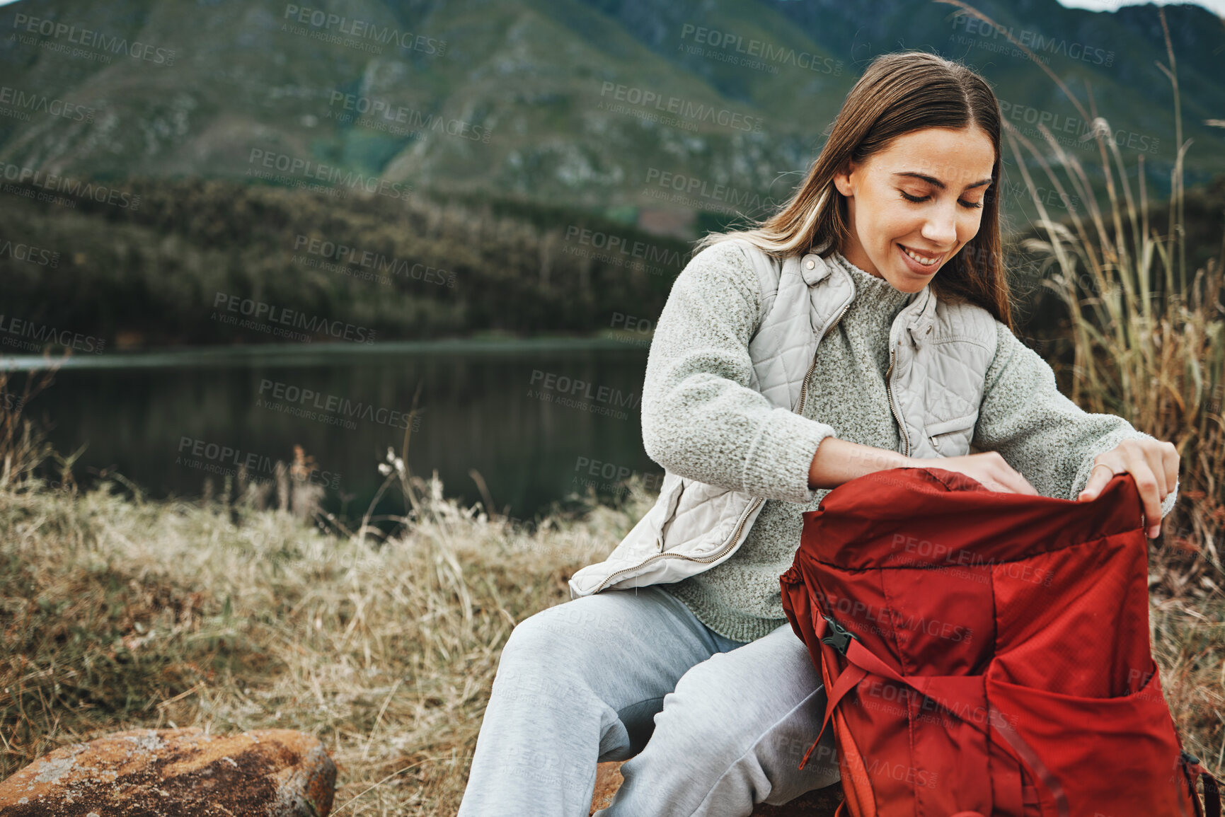 Buy stock photo Nature, backpack and young woman hiking on a mountain for adventure, weekend trip or vacation. Happy, bag and female person from Canada trekking and camping in an outdoor forest or woods for holiday.