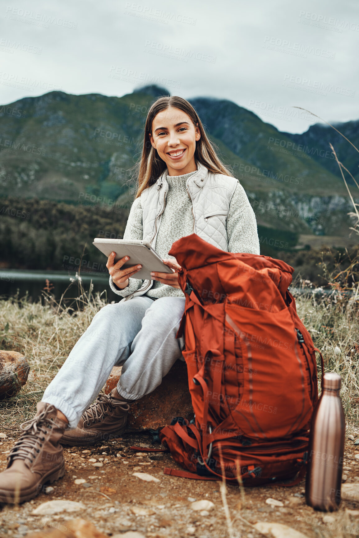 Buy stock photo Tablet, backpack and woman trekking in nature on mountain for adventure, weekend trip or vacation. Digital technology, bag and female person from Canada network on social media and hiking in forest.