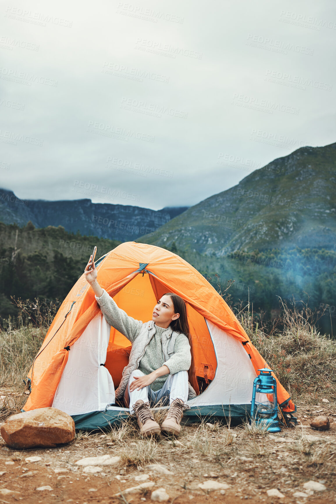 Buy stock photo Camping, selfie and woman in nature with phone for social media, memory or scenic photo in nature. Tent, profile picture or lady influencer with smartphone photography in a forest for blog or podcast