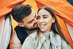 Happy couple, kiss and tent for camping, holiday or outdoor vacation together in affection, bonding or nature. Face of man kissing woman with smile on camp site for travel, love or trip in adventure